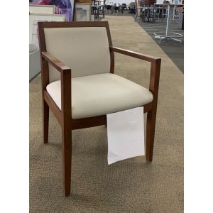 Angle view of Pre-owned Global wood side chair has light tan upholstered seat and back, with a cherry frame with (4) post legs. -A GRADE-