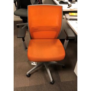Pre-owned Sit On It Amplify task chair has orange seat and mesh back.