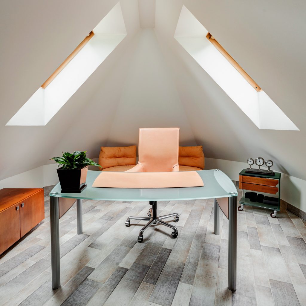 The minimalist office; a glass top table desk and posture-friendly chair.